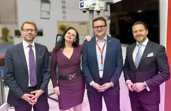 Michael Kulig, Daniela Gröbel-Becker, Sven Horstmann and Sebastian Kulig at the Klüh Security GmbH exhibition stand