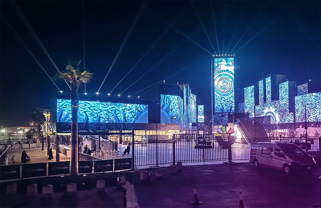 View of Riyadh, Saudi Arabia during a business trip, featuring cityscape and vibrant lighting.