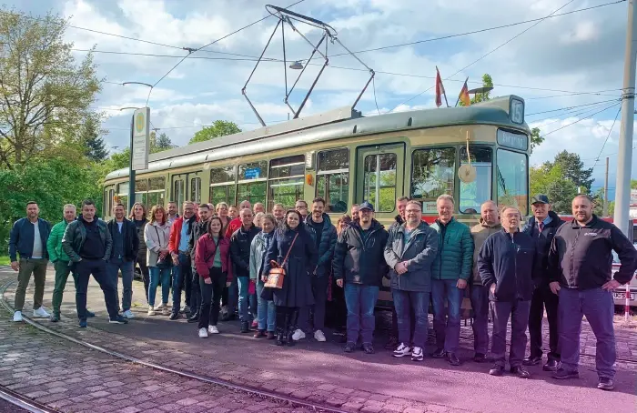 Group photo in front of a historic tram in Nuremberg